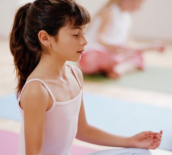 Close-up of a young girl meditating