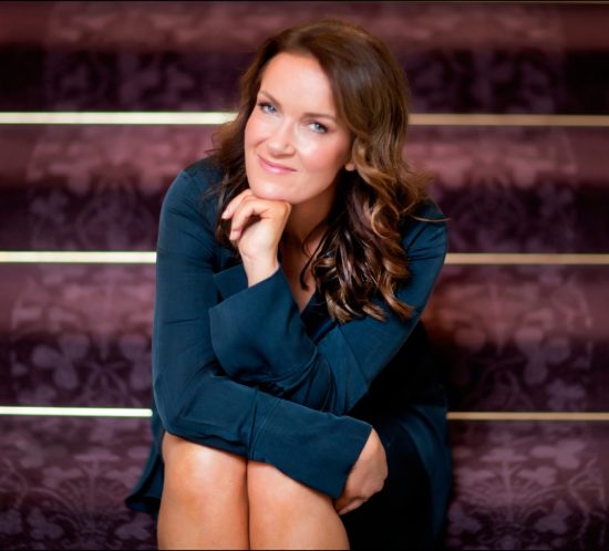 Woman sitting on the stairs and smiling